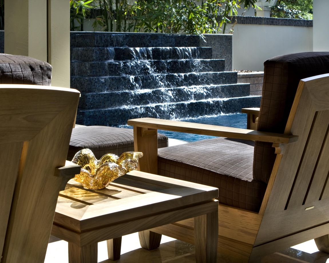 The sound of water can make your outdoor space feel like a getaway. Project by Phil Kean Design Group.
