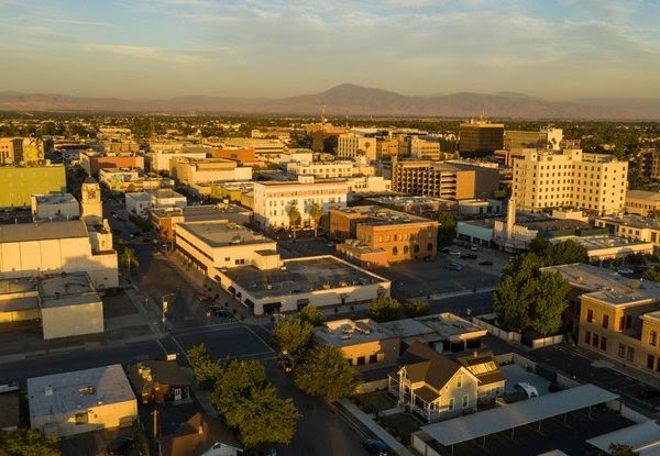he southern city center downtown area of Bakersfield aerial view illuminated by late afternoon light