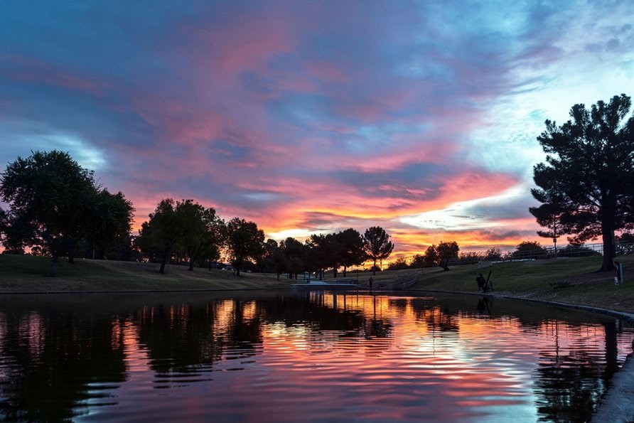 Sunrise over the pond in Greenfield Park in Mesa, Arizona near Phoenix