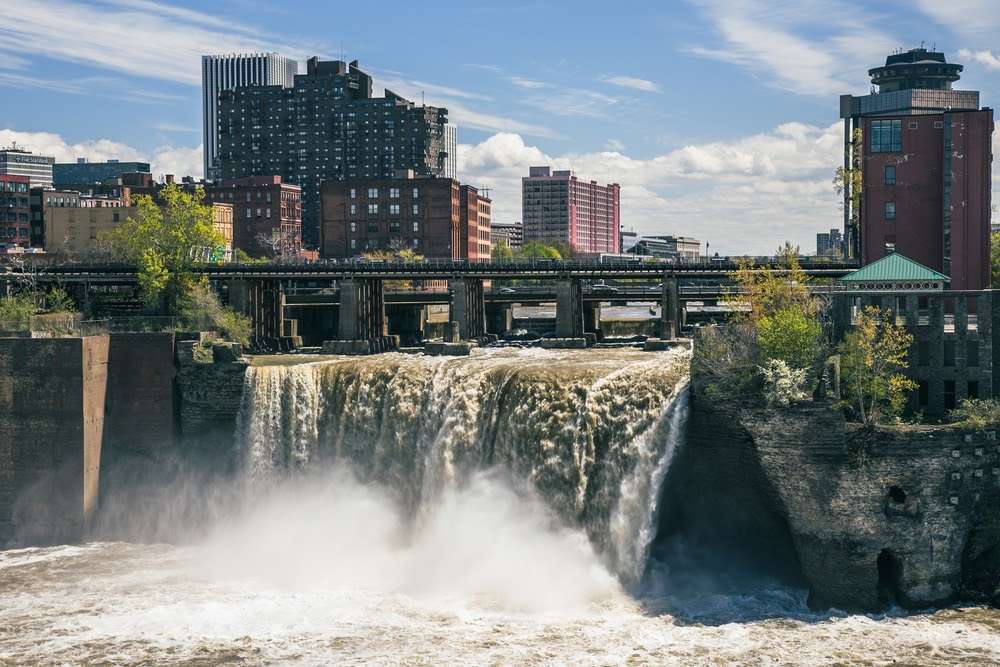The High Falls surrounded by buildings under the sunlight in Rochester, New York State, the USA