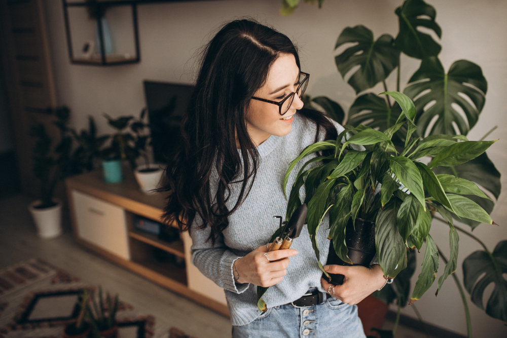 young woman taking care of plants
